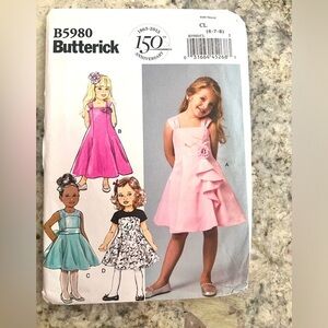 Butterick‎ B5980 girls dress uncut pattern four different dresses.